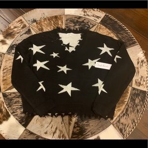 NWT black with stars rag sweater.